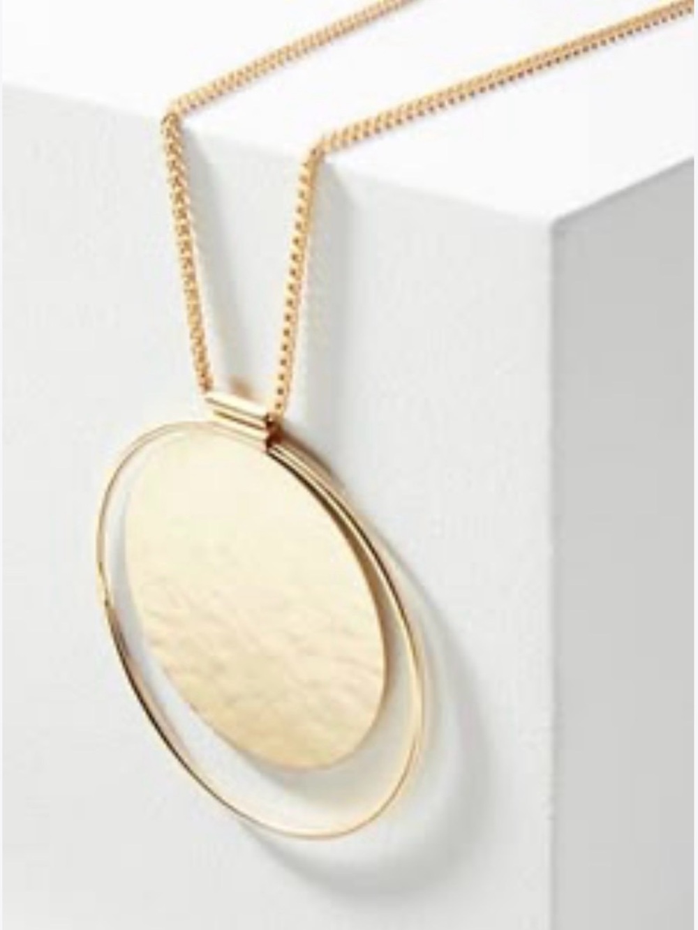 Long gold medallion necklace